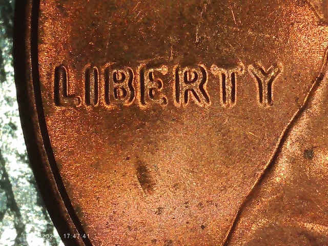 2022 penny doubled die error close-up showing doubled lettering on LIBERTY