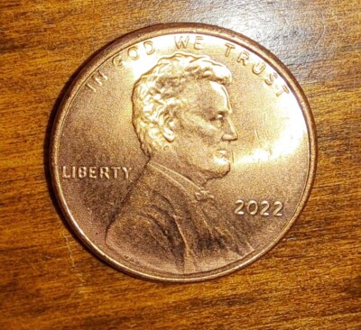 2022 penny struck-through error showing impression of foreign object on Lincoln portrait area